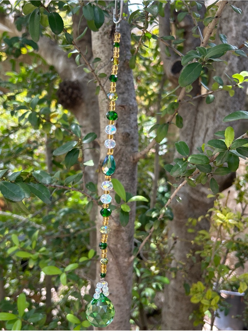Handmade emerald green and gold crystal beaded strand suncatcher